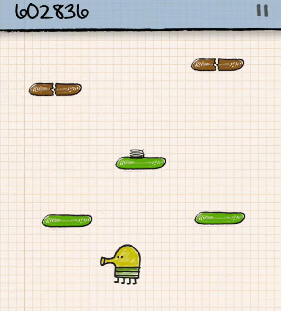 ドゥードルジャンプ 2(Doodle Jump 2)のゲーム画面: 方眼紙のステージでドゥードラーがバネ付きの足場や壊れた足場を使って上を目指す場面